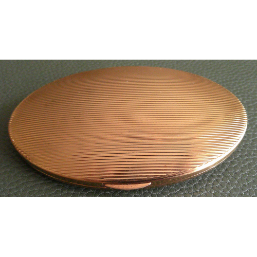 A Vintage Oval and Black Compact